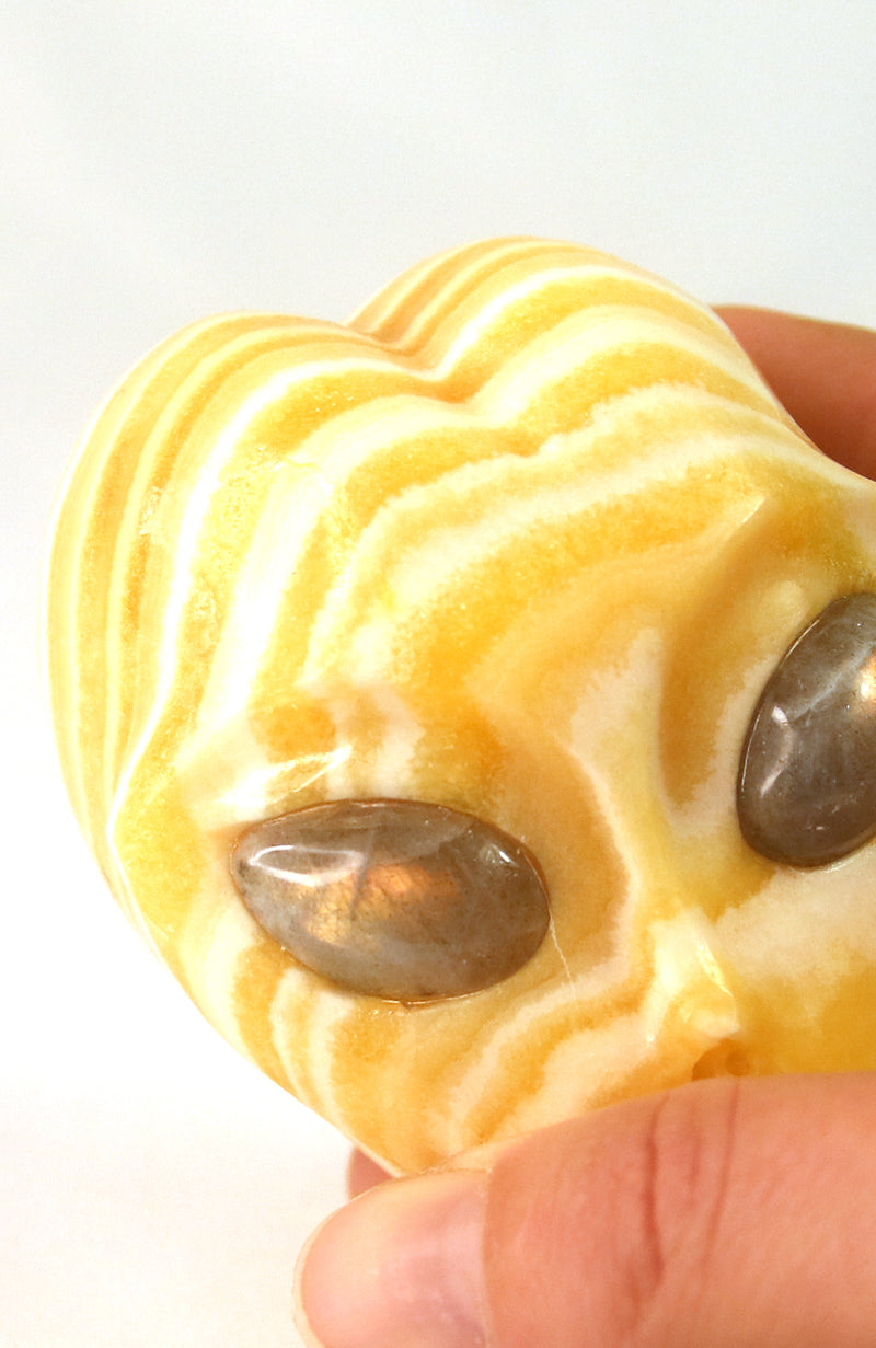 Orange Calcite ET with Labradorite Eyes Skull